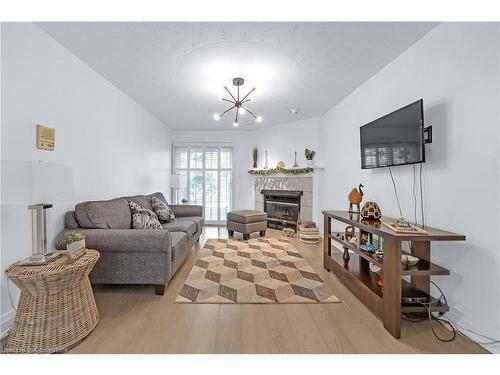 13-1205 Lamb'S Court, Burlington, ON - Indoor Photo Showing Living Room With Fireplace