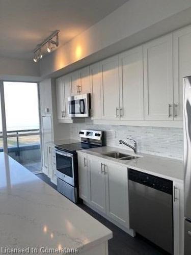 1104-550 North Service Road, Grimsby, ON - Indoor Photo Showing Kitchen With Double Sink