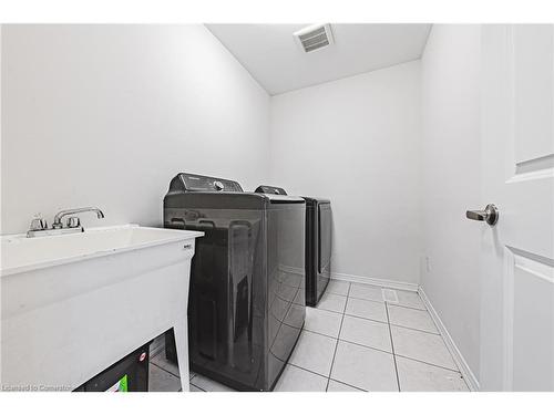 11 Mcwatters Street, Binbrook, ON - Indoor Photo Showing Laundry Room