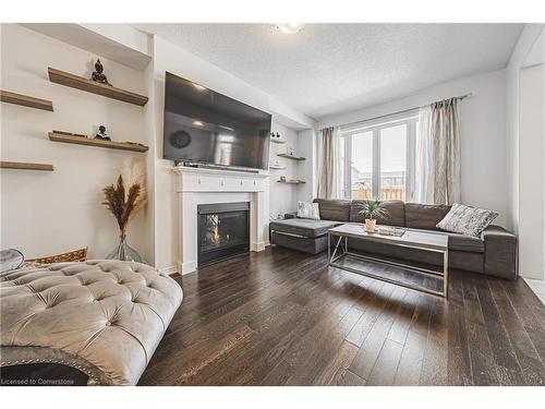 11 Mcwatters Street, Binbrook, ON - Indoor Photo Showing Living Room With Fireplace