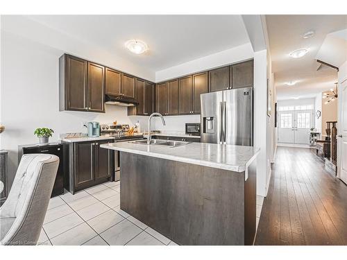 11 Mcwatters Street, Binbrook, ON - Indoor Photo Showing Kitchen With Double Sink With Upgraded Kitchen