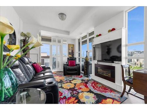 309-10 Concord Place, Grimsby, ON - Indoor Photo Showing Living Room With Fireplace