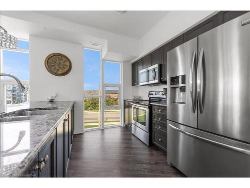 309-10 Concord Place, Grimsby, ON - Indoor Photo Showing Kitchen With Stainless Steel Kitchen With Double Sink