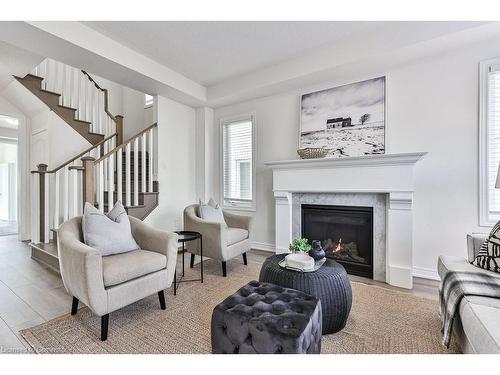 99 Kenesky Drive, Waterdown, ON - Indoor Photo Showing Living Room With Fireplace