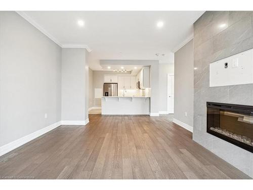 403-1878 Gordon Street, Guelph, ON - Indoor Photo Showing Living Room With Fireplace