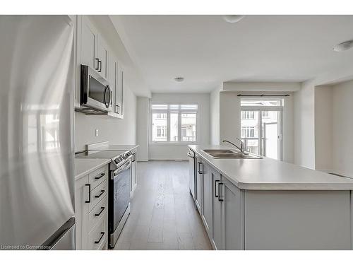 16-40 Zinfandel Drive, Stoney Creek, ON - Indoor Photo Showing Kitchen With Double Sink