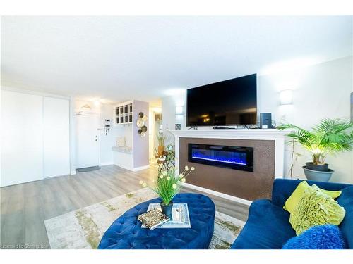 614-500 Green Road, Stoney Creek, ON - Indoor Photo Showing Living Room With Fireplace