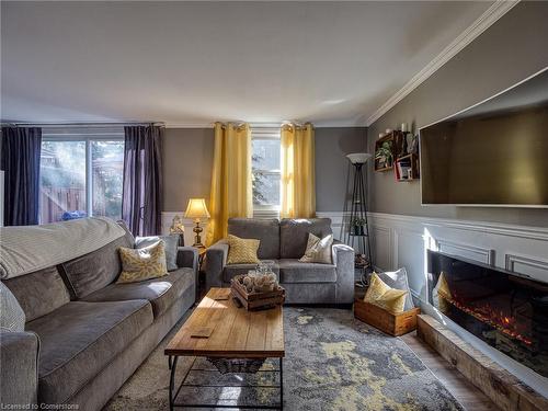 1-594 Durham Crescent, Woodstock, ON - Indoor Photo Showing Living Room With Fireplace