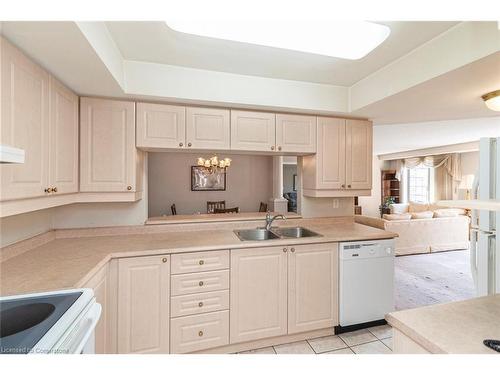 B405-216 Plains Road W, Burlington, ON - Indoor Photo Showing Kitchen With Double Sink