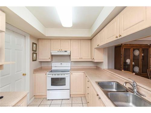 B405-216 Plains Road W, Burlington, ON - Indoor Photo Showing Kitchen With Double Sink