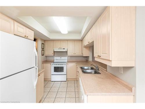 B405-216 Plains Road W, Burlington, ON - Indoor Photo Showing Kitchen With Double Sink