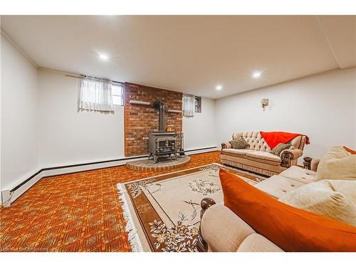 83 South Bend Road W, Hamilton, ON - Indoor Photo Showing Basement With Fireplace