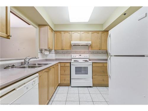 1208-100 Burloak Drive, Burlington, ON - Indoor Photo Showing Kitchen With Double Sink