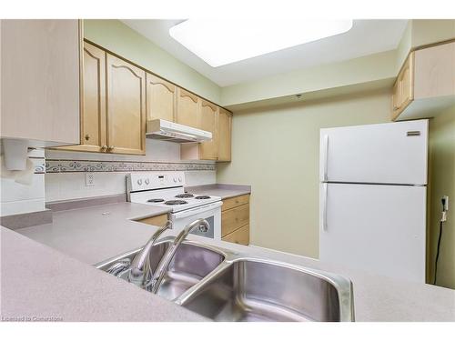 1208-100 Burloak Drive, Burlington, ON - Indoor Photo Showing Kitchen With Double Sink