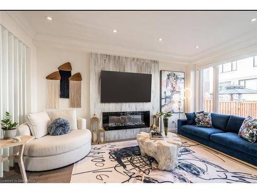 128 Fairey Crescent, Mount Hope, ON - Indoor Photo Showing Living Room With Fireplace