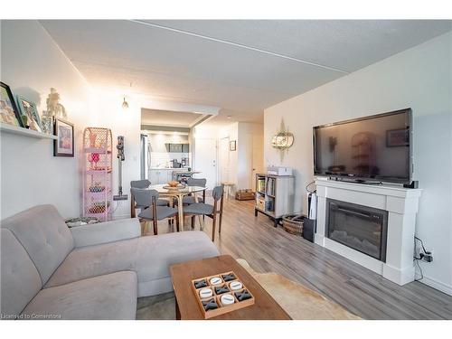 205-41 Rykert Street, St. Catharines, ON - Indoor Photo Showing Living Room With Fireplace