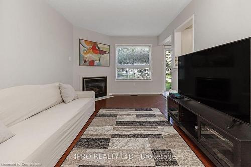 112-2555 Thomas Street, Mississauga, ON - Indoor Photo Showing Living Room With Fireplace