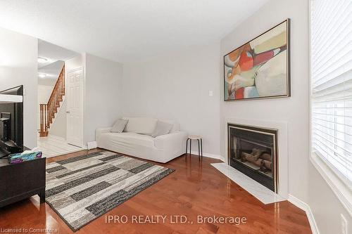 112-2555 Thomas Street, Mississauga, ON - Indoor Photo Showing Living Room With Fireplace