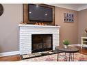 141 Reid Avenue S, Hamilton, ON  - Indoor Photo Showing Living Room With Fireplace 