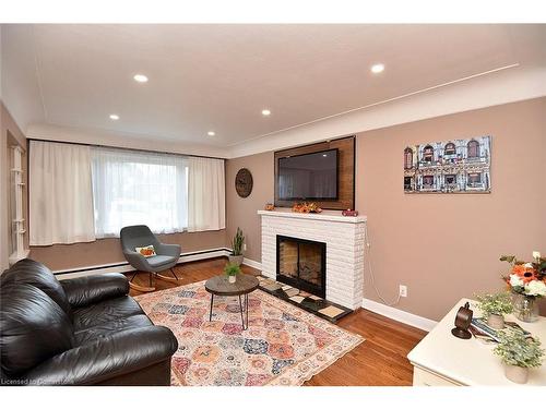 141 Reid Avenue S, Hamilton, ON - Indoor Photo Showing Living Room With Fireplace