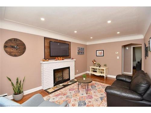 141 Reid Avenue S, Hamilton, ON - Indoor Photo Showing Living Room With Fireplace