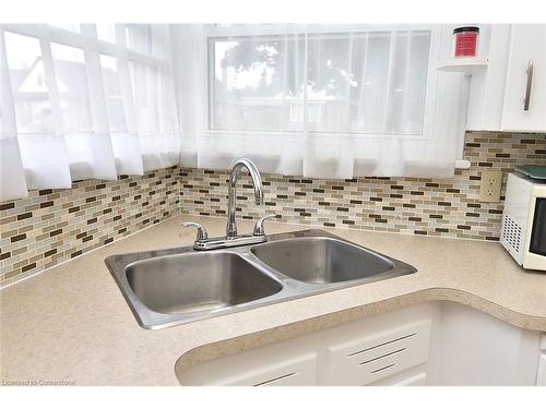 141 Reid Avenue S, Hamilton, ON - Indoor Photo Showing Kitchen With Double Sink With Upgraded Kitchen