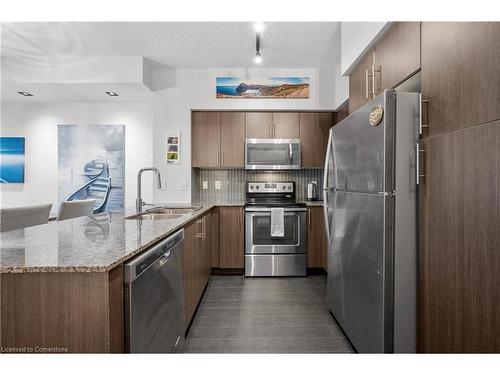 1110-65 Speers Road, Oakville, ON - Indoor Photo Showing Kitchen With Stainless Steel Kitchen With Upgraded Kitchen