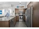 1110-65 Speers Road, Oakville, ON  - Indoor Photo Showing Kitchen With Stainless Steel Kitchen With Upgraded Kitchen 