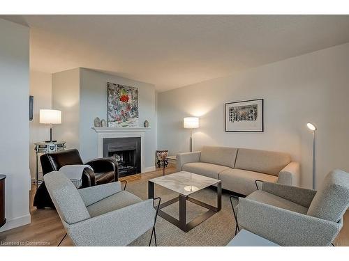 1003-700 Dynes Road, Burlington, ON - Indoor Photo Showing Living Room With Fireplace