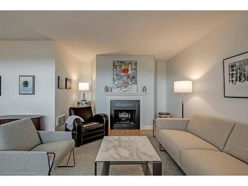 1003-700 Dynes Road, Burlington, ON - Indoor Photo Showing Living Room With Fireplace