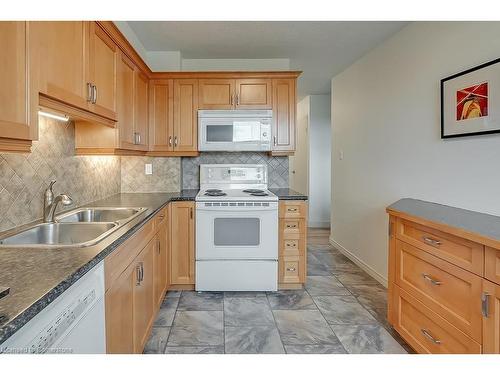 1003-700 Dynes Road, Burlington, ON - Indoor Photo Showing Kitchen With Double Sink