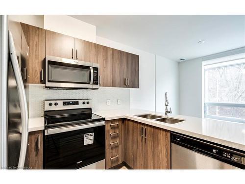 102-479 Charlton Avenue E, Hamilton, ON - Indoor Photo Showing Kitchen With Stainless Steel Kitchen With Double Sink With Upgraded Kitchen