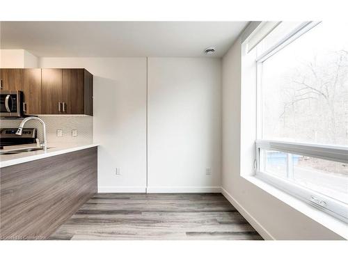 102-479 Charlton Avenue E, Hamilton, ON - Indoor Photo Showing Kitchen With Double Sink