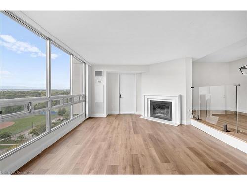 1501-2175 Marine Drive, Oakville, ON - Indoor Photo Showing Living Room With Fireplace