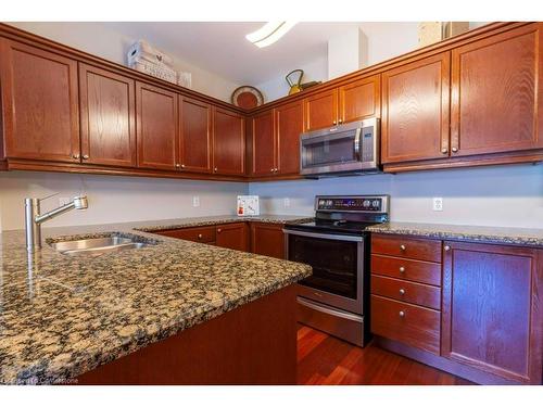 207-1499 Nottinghill Gate, Oakville, ON - Indoor Photo Showing Kitchen With Double Sink