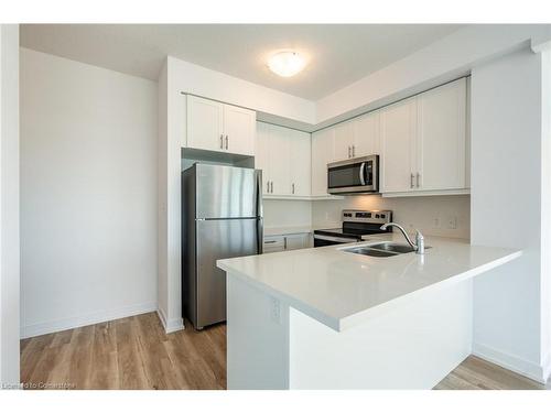 902-470 Dundas Street E, Waterdown, ON - Indoor Photo Showing Kitchen With Double Sink