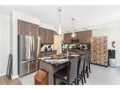 67 Larry Crescent, Caledonia, ON - Indoor Photo Showing Kitchen With Stainless Steel Kitchen With Double Sink With Upgraded Kitchen