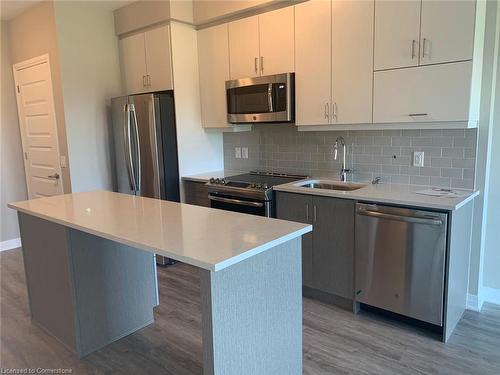 520-128 Grovewood Common, Oakville, ON - Indoor Photo Showing Kitchen With Stainless Steel Kitchen With Upgraded Kitchen