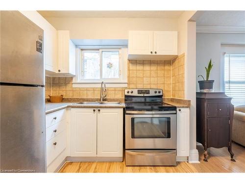 10 Welland Vale Road, St. Catharines, ON - Indoor Photo Showing Kitchen With Double Sink