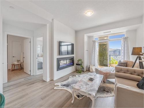 301-600 North Service Road, Stoney Creek, ON - Indoor Photo Showing Living Room With Fireplace