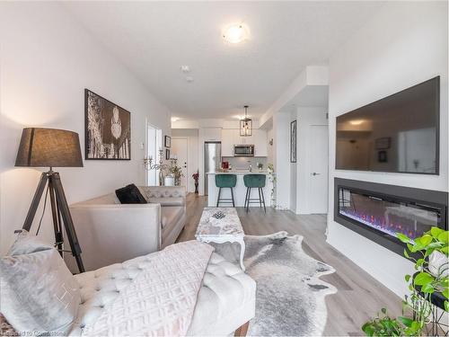 301-600 North Service Road, Stoney Creek, ON - Indoor Photo Showing Living Room With Fireplace