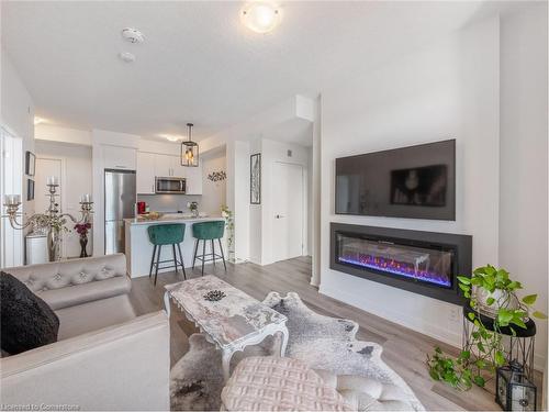 301-600 North Service Road, Stoney Creek, ON - Indoor Photo Showing Living Room With Fireplace