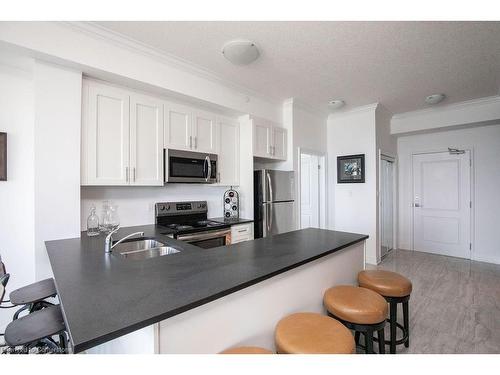 608-101 Shoreview Place, Stoney Creek, ON - Indoor Photo Showing Kitchen With Double Sink