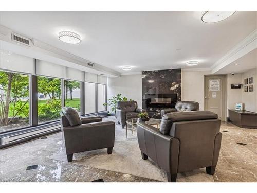 1411-500 Green Road, Stoney Creek, ON - Indoor Photo Showing Living Room With Fireplace