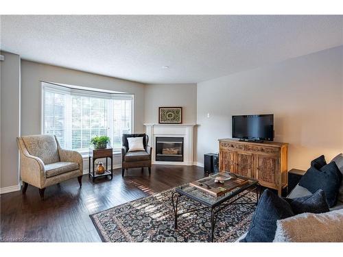 18-2880 Headon Forest Drive, Burlington, ON - Indoor Photo Showing Living Room With Fireplace