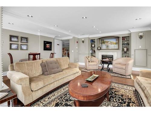 807-3000 Creekside Drive, Dundas, ON - Indoor Photo Showing Living Room With Fireplace