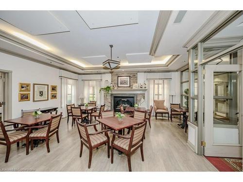 2505-100 Burloak Drive, Burlington, ON - Indoor Photo Showing Other Room With Fireplace