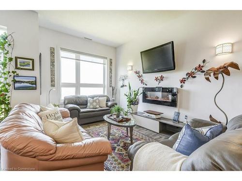 627-125 Shoreview Place, Stoney Creek, ON - Indoor Photo Showing Living Room With Fireplace