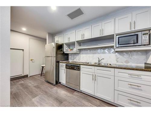 101-40 Old Mill Road, Oakville, ON - Indoor Photo Showing Kitchen With Double Sink