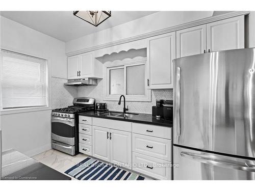 5317 Third Avenue, Niagara Falls, ON - Indoor Photo Showing Kitchen With Double Sink